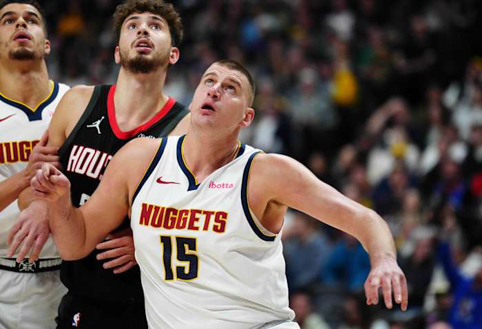 Nuggets center Nikola Jokic and forward Michael Porter Jr. (1) and Houston Rockets center Alperen Sengun (28) during the first quarter at Ball Arena